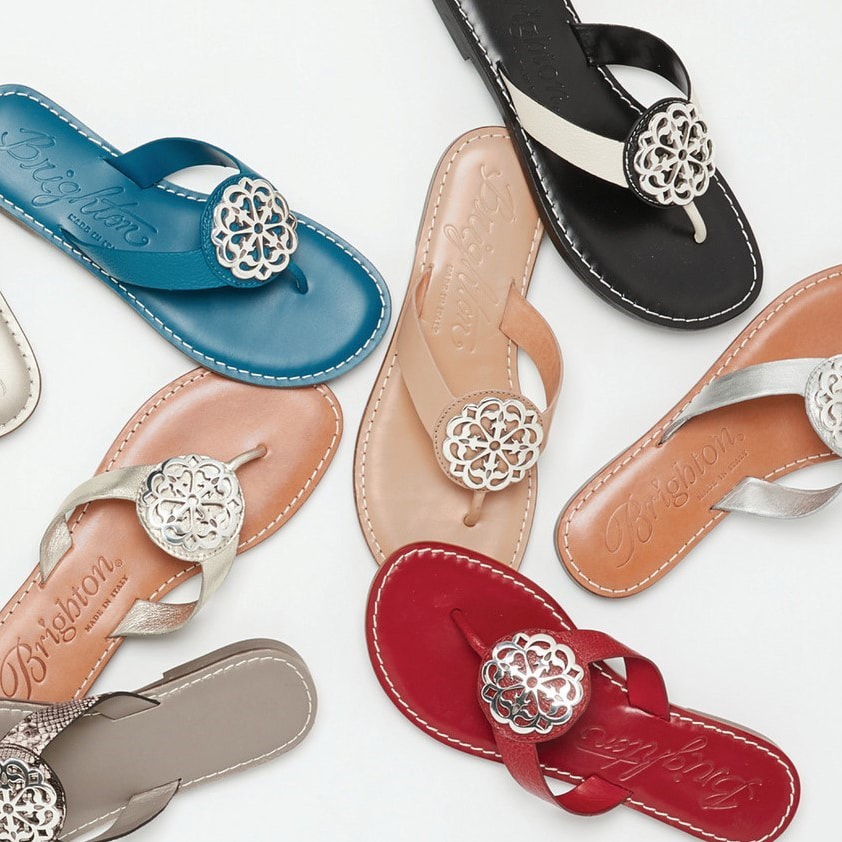 Variety of flip flops in different colors (blue, black, beige, red)